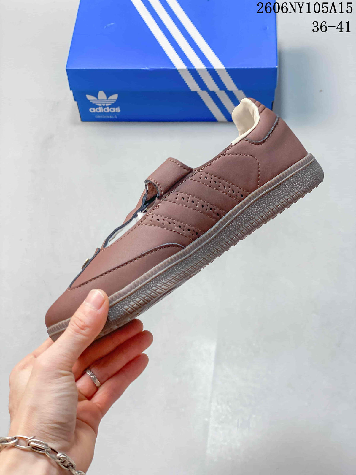 Side profile showing perforated details and the T-strap closure