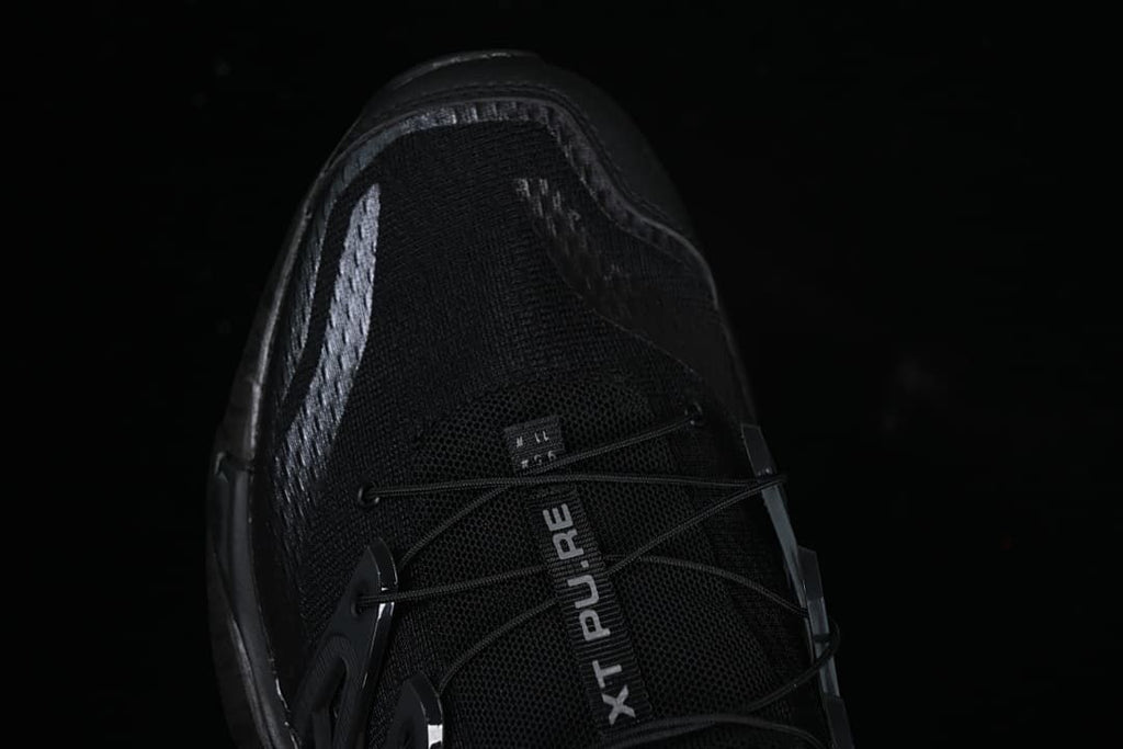 Top view of the toe and lace system with XT Pure branding.