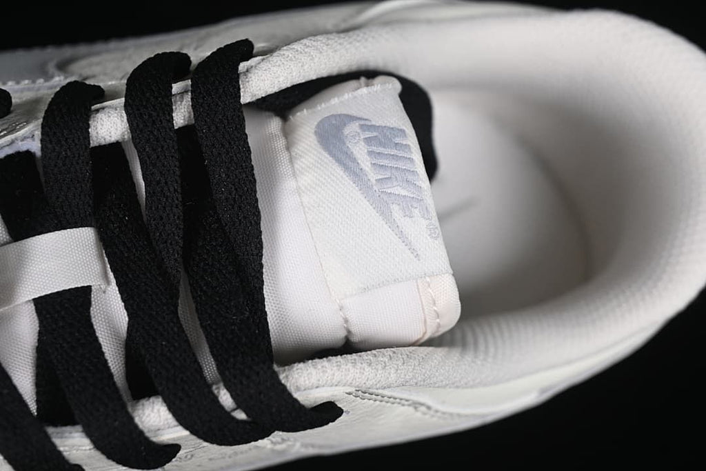 Close-up of the tongue label and black laces.