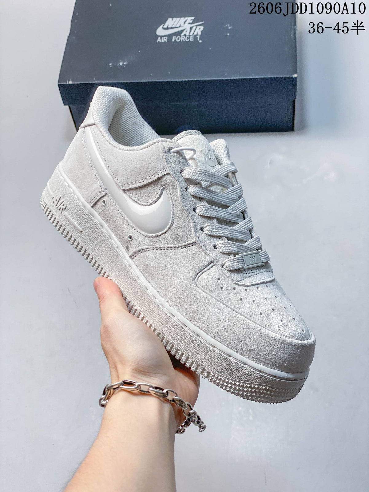 White Nike Air Force 1 sneaker shown from the side.