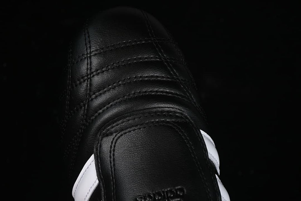 Top-down detail of the stitched black toe area.