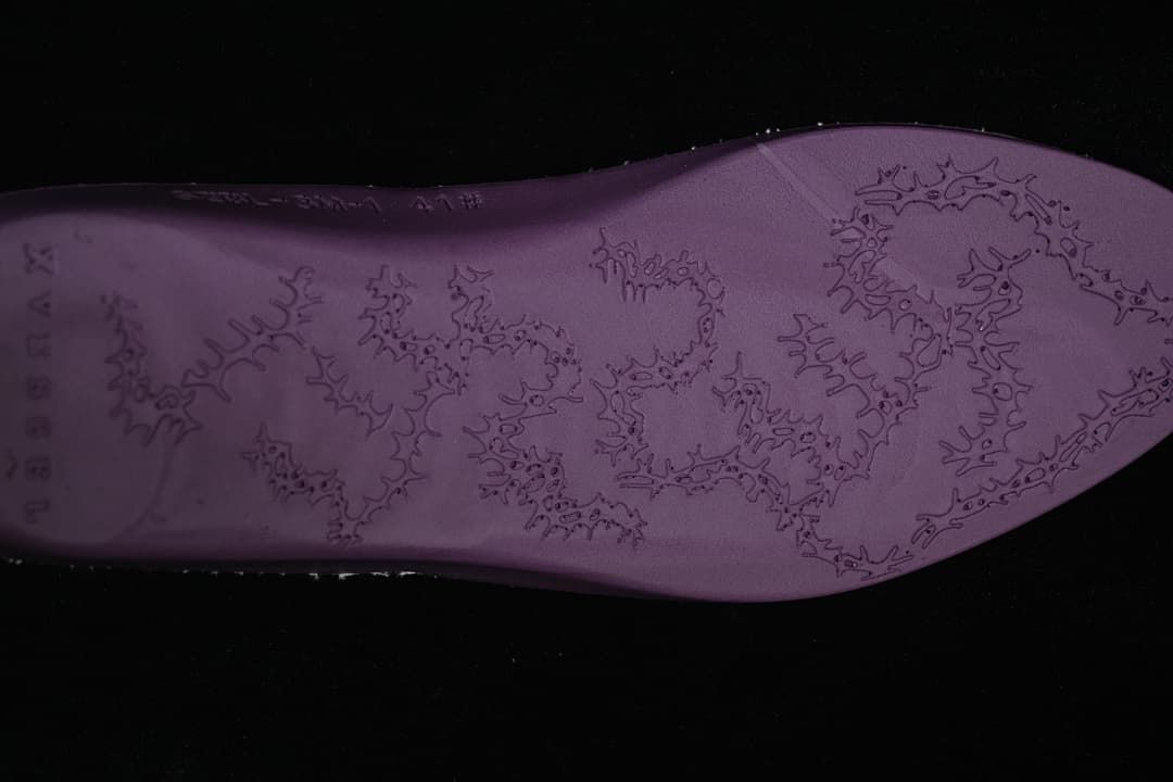 Close-up of the sneaker outsole with an embossed pattern