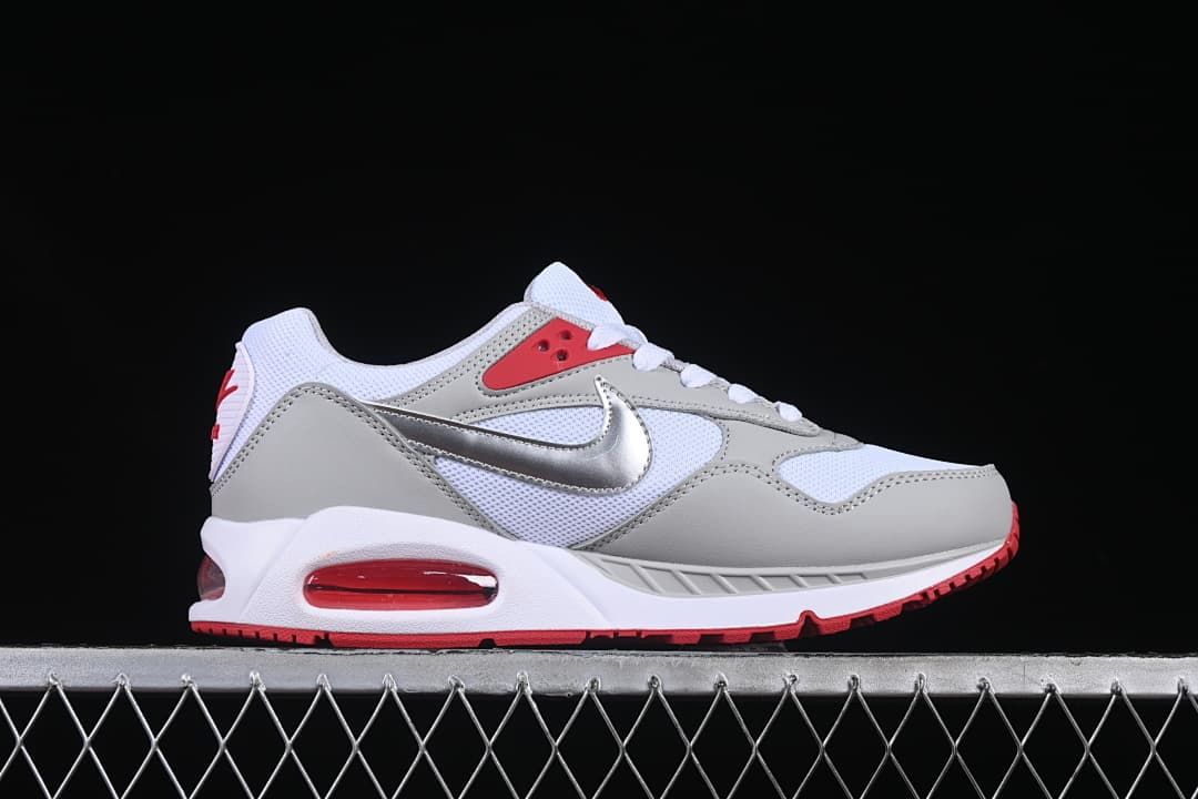 Side profile highlighting the layered upper, silver swoosh, and red heel unit.