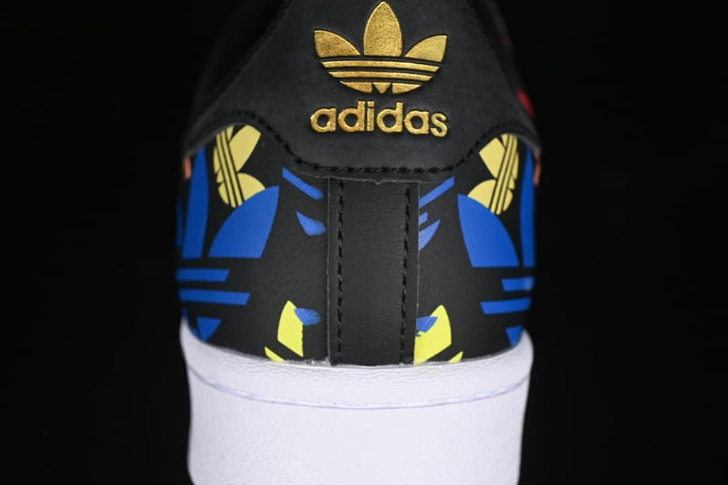Rear view showing gold heel branding and colorful graphic panels