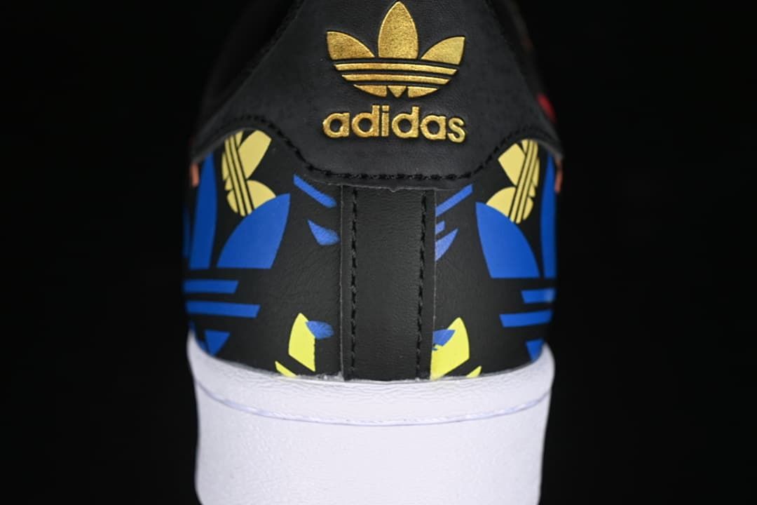 Rear view showing gold heel branding and colorful graphic panels