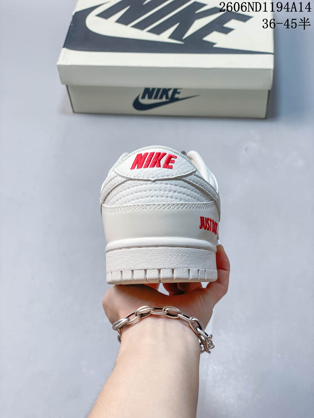 Rear view showing red Nike embroidery and heel lettering