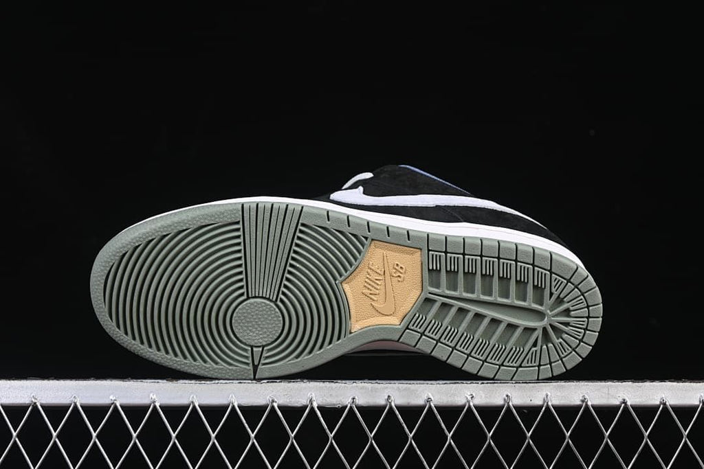 Outsole view showing the circular tread pattern and muted green-grey colour