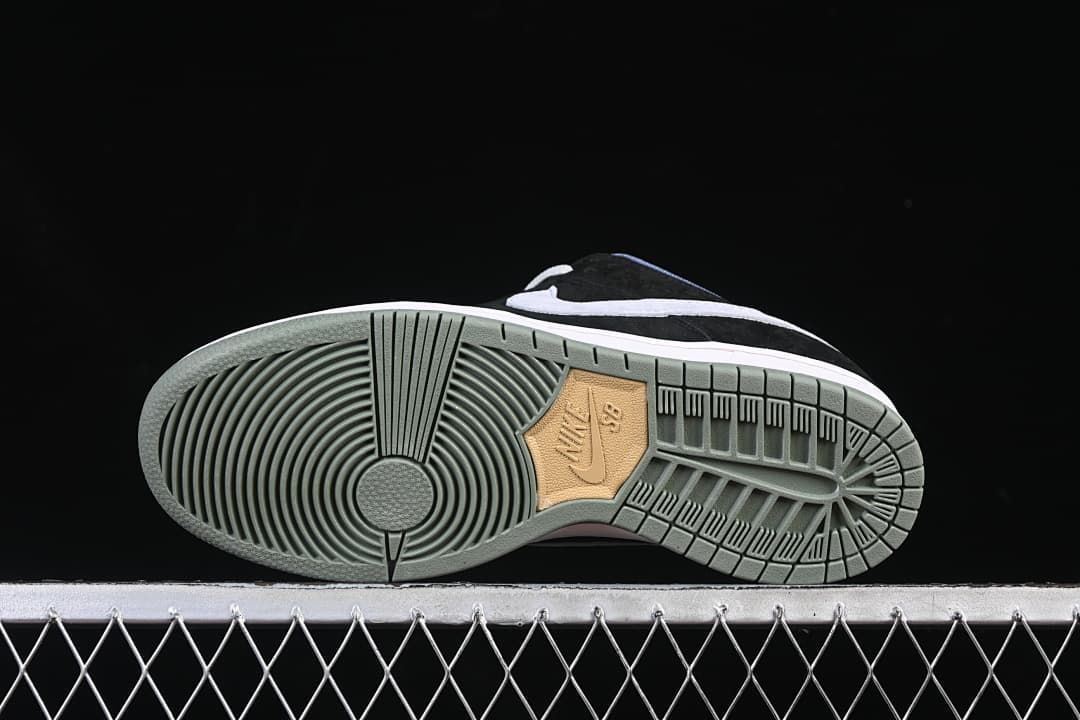 Outsole view showing the circular tread pattern and muted green-grey colour