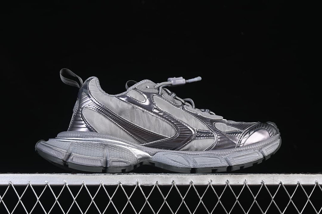 Outer side profile of the grey sneaker.