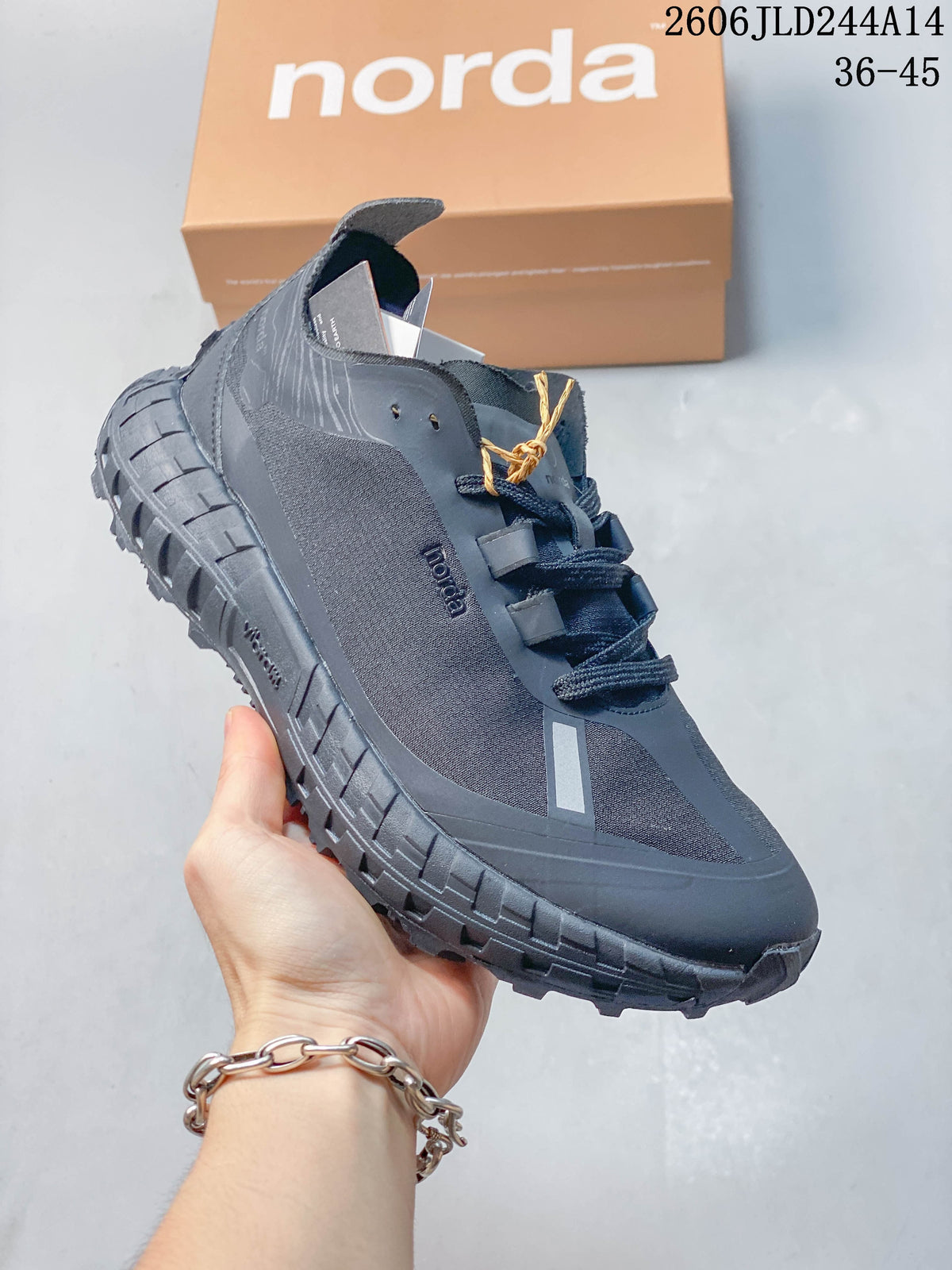 Angled side view of the black norda shoe showing the tonal upper, branding and thick outsole.