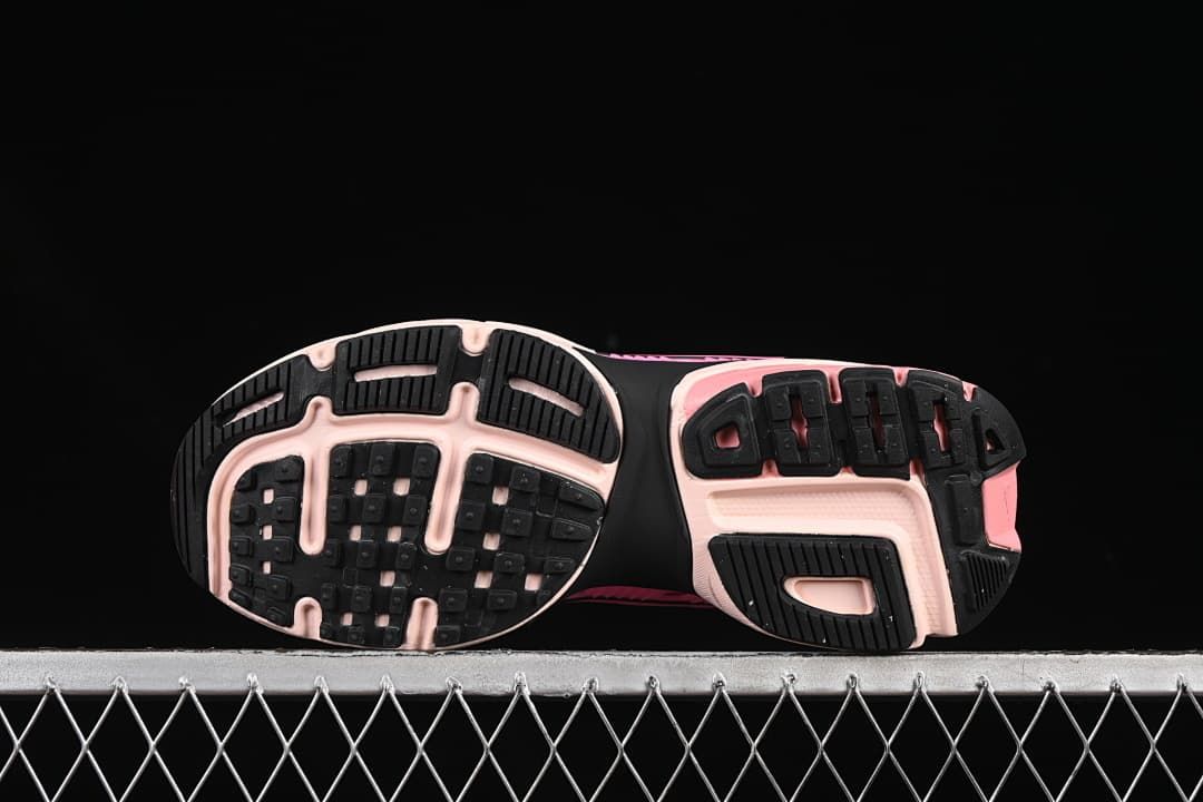 Underside view showing black and pale pink outsole sections