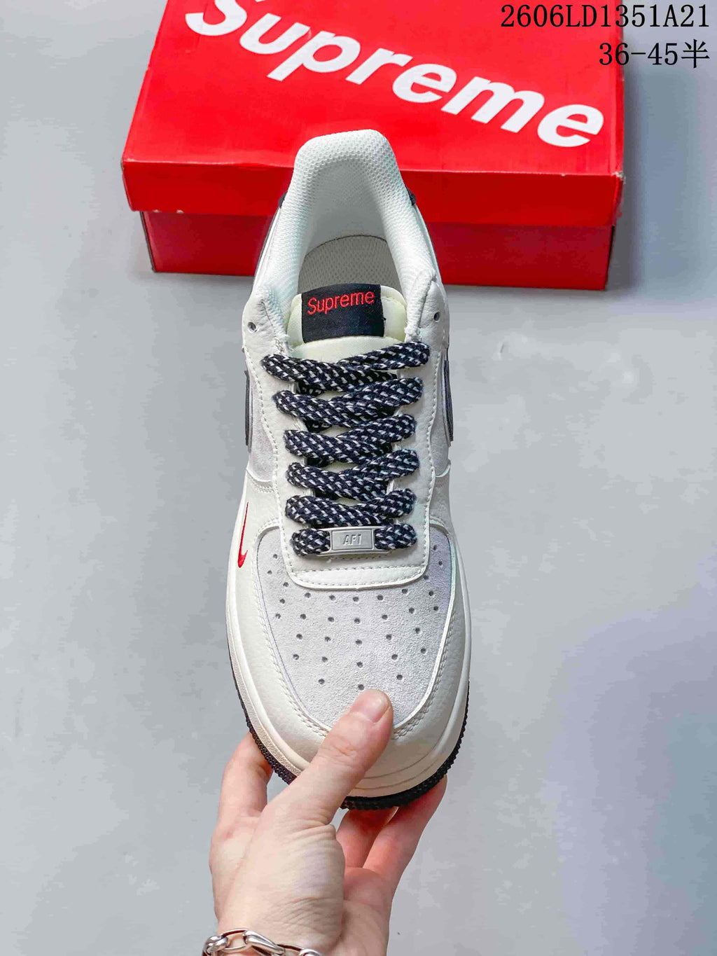 Top view showing the perforated toe, patterned laces, and red accent detail.