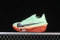 Side view of pale mint and coral Nike Zoom Vaporfly Next% 3 running shoe