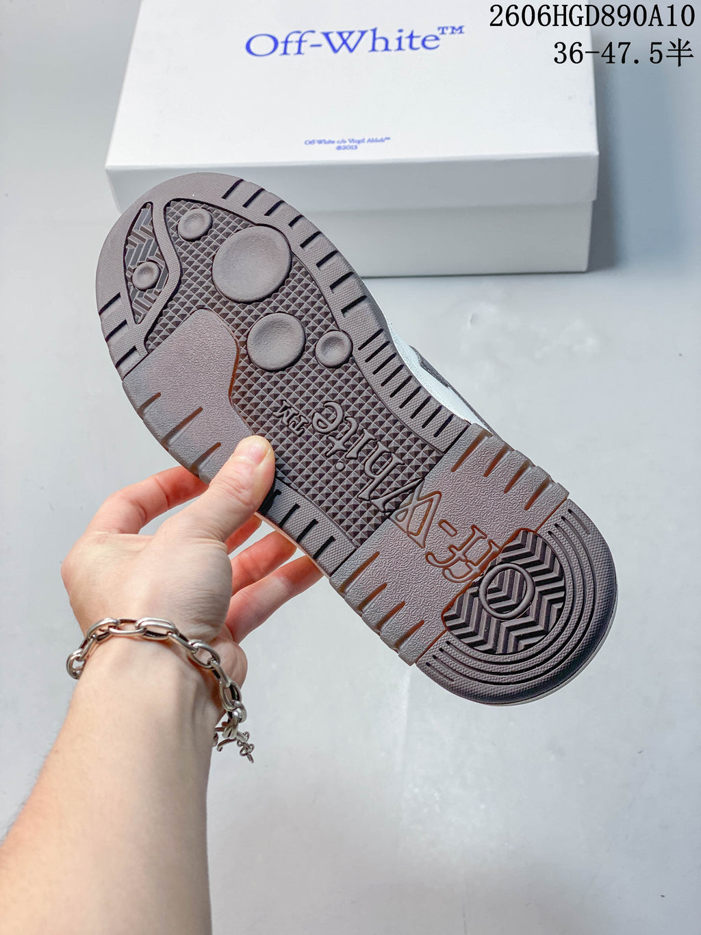 Close-up of the sneakers’ brown patterned outsole.