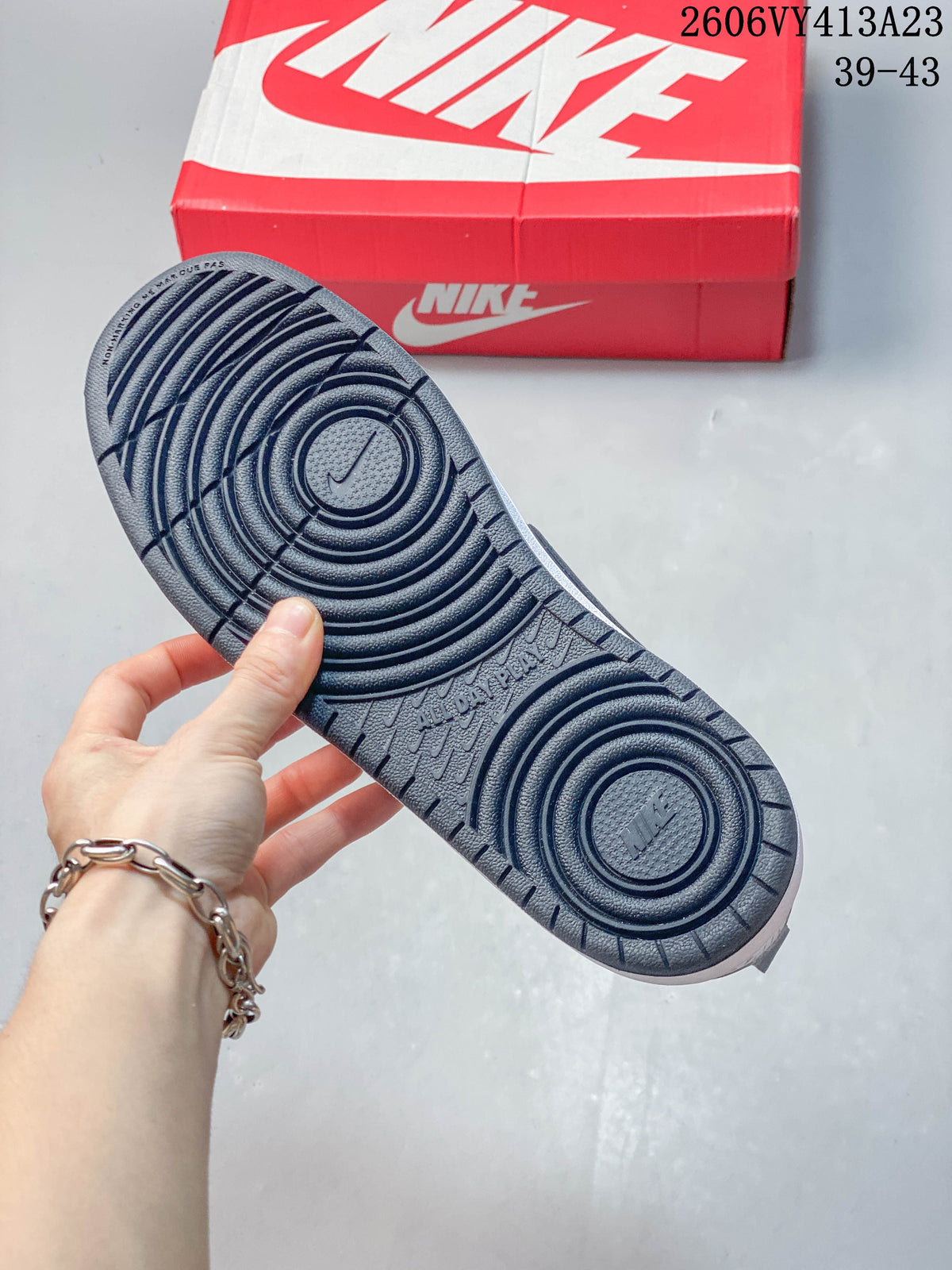 Close-up of the patterned dark outsole on a NikeCourt Borough 2 sneaker