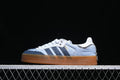 Side view of blue denim-look adidas Samba sneakers with a raised gum-colored sole