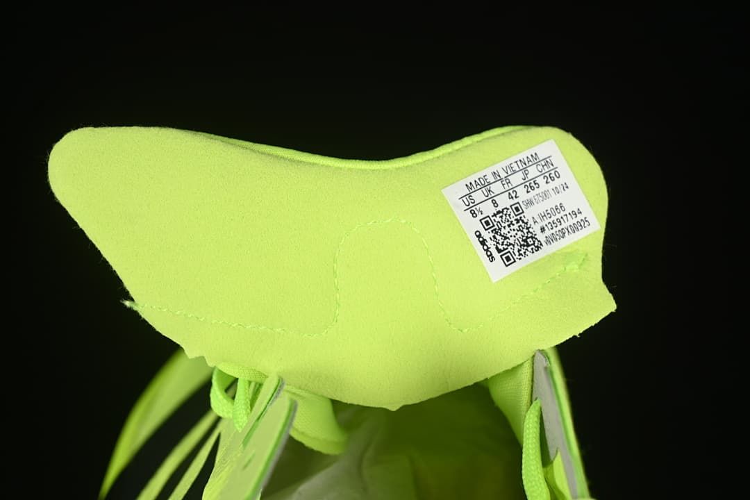 Tongue label showing a photographed shoe size and model code