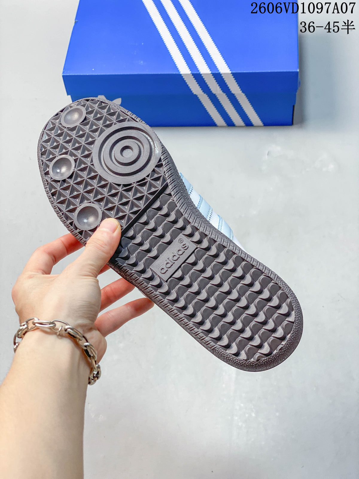 Underside view showing the patterned dark outsole of an adidas Samba OG mule