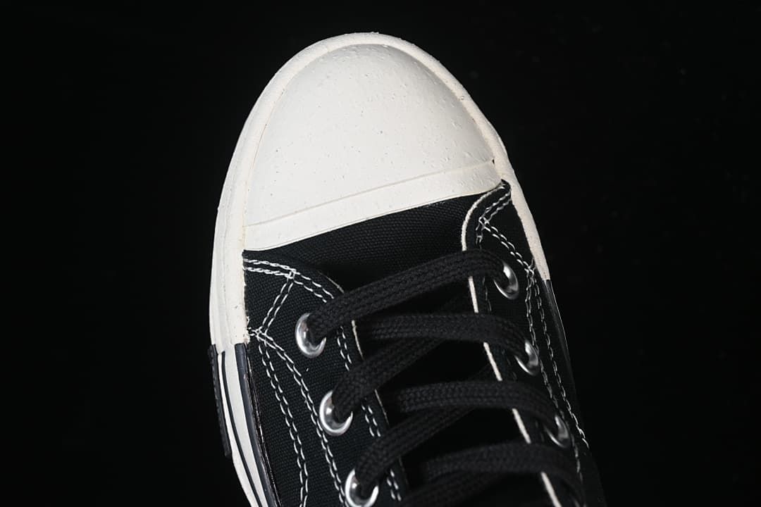 Top view of the black laces and white toe cap