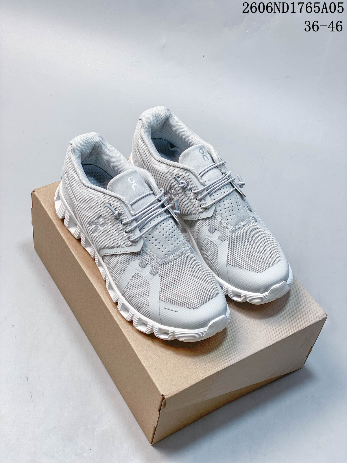 Pair of light grey On Cloud 5 sneakers shown on a box