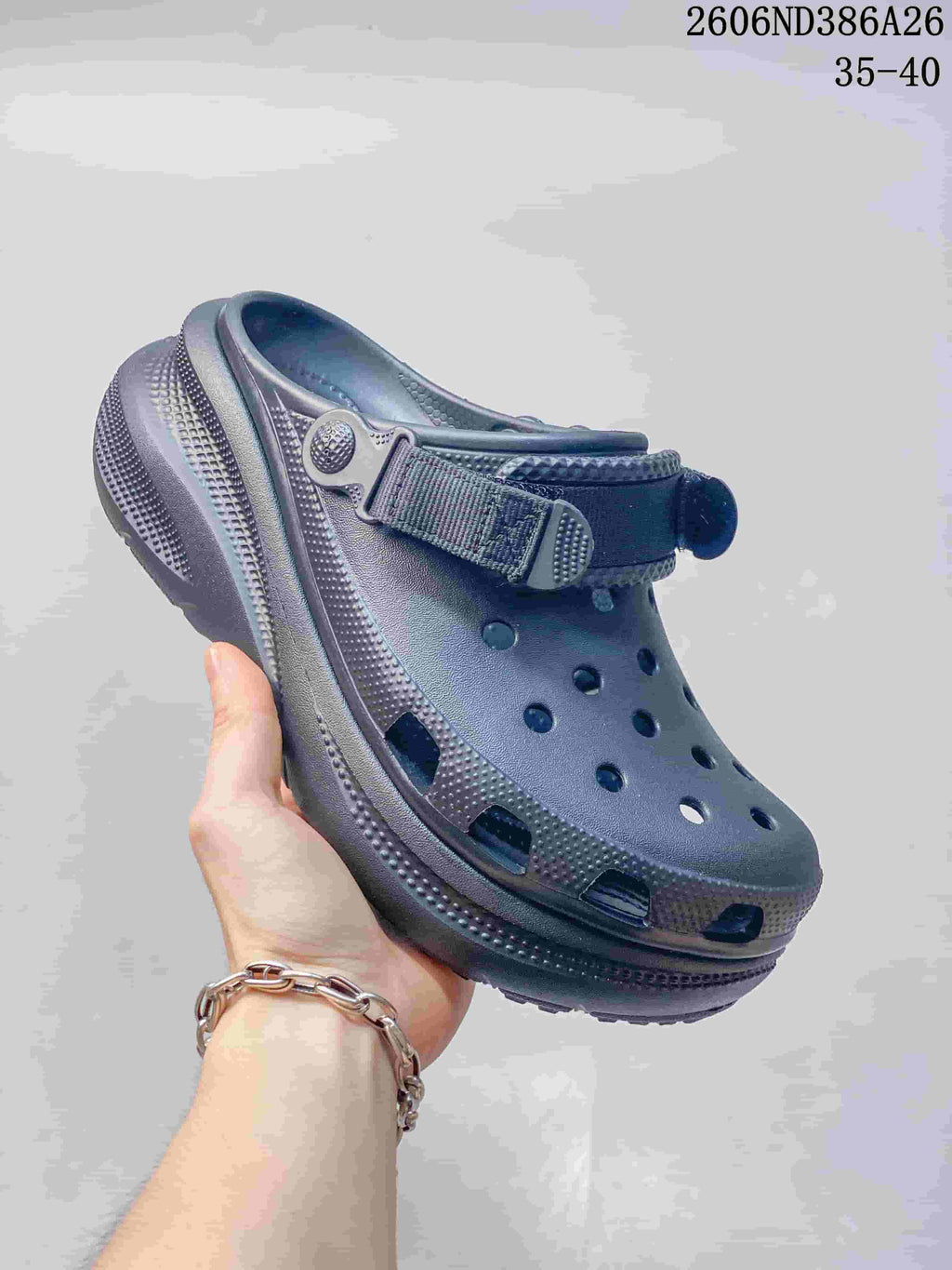 Dark gray perforated clog sandal with adjustable heel strap and chunky sole