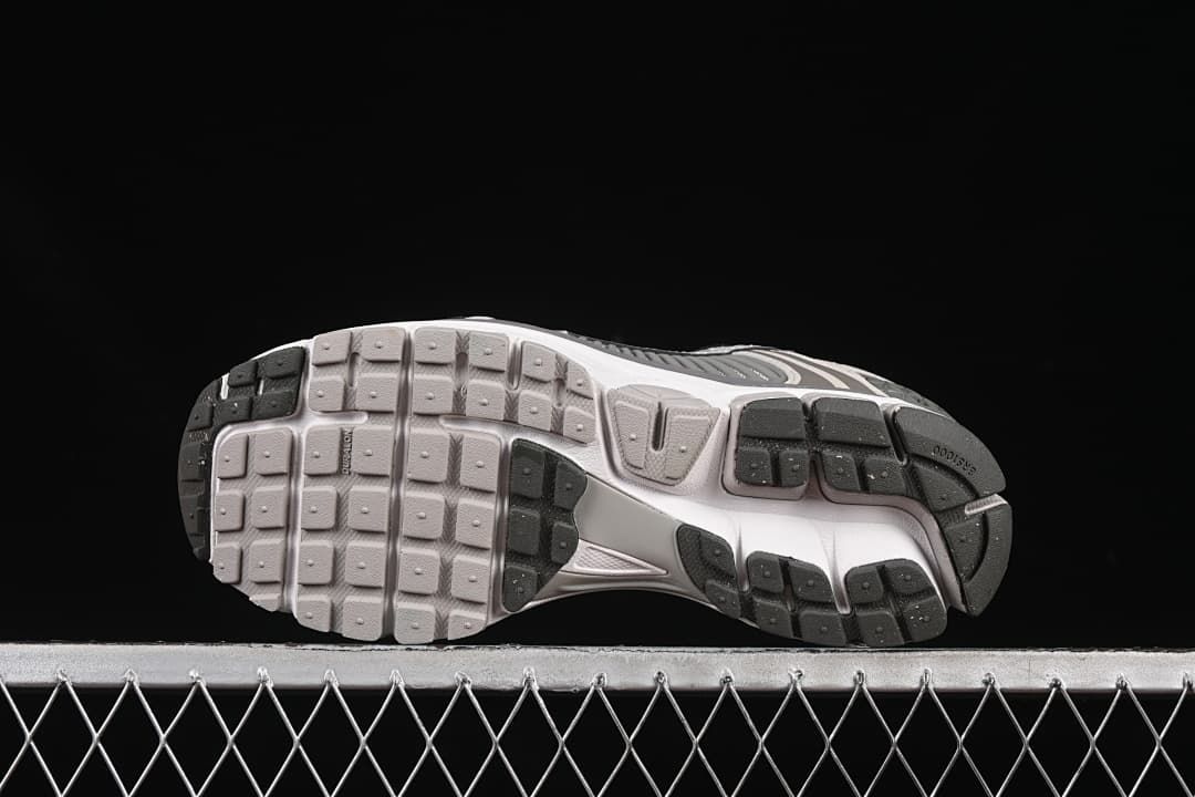 Underside view showing the segmented outsole.