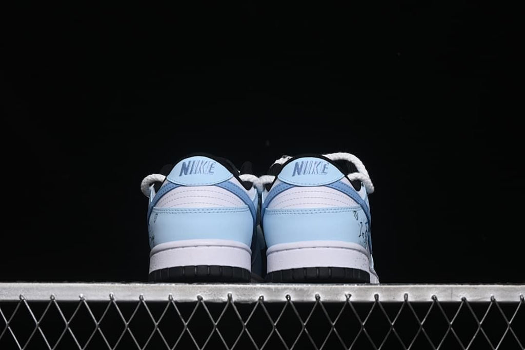 Rear view of the pair showing light-blue heel panels