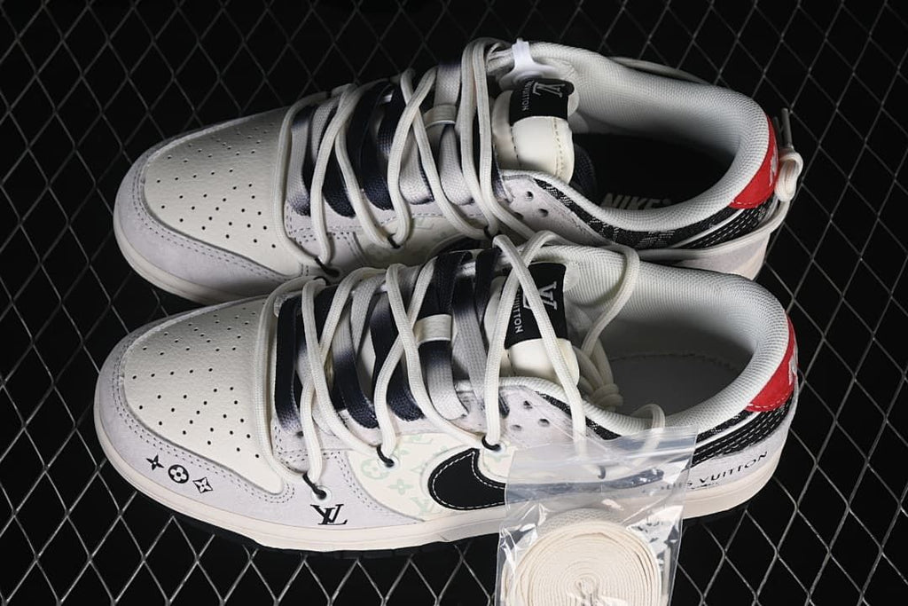 Two white and black low-top sneakers shown from above, with an extra pair of white laces