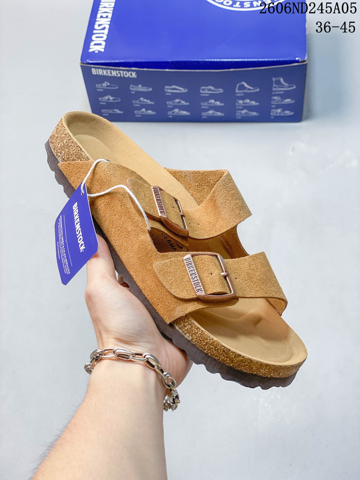 Warm tan two-strap sandal with buckle detailing and contoured footbed.