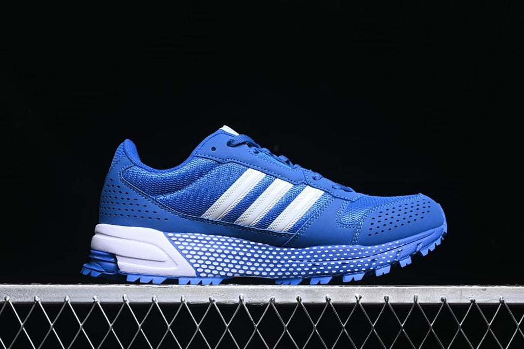 Side profile of the blue sneaker with white stripes