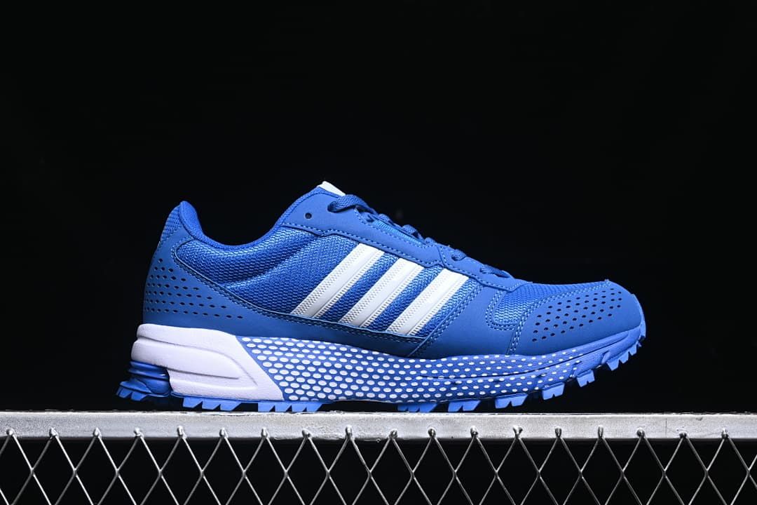 Side profile of the blue sneaker with white stripes