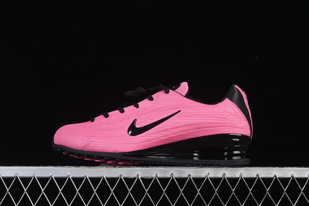 Side profile of a pink and black Nike Shox Z shoe
