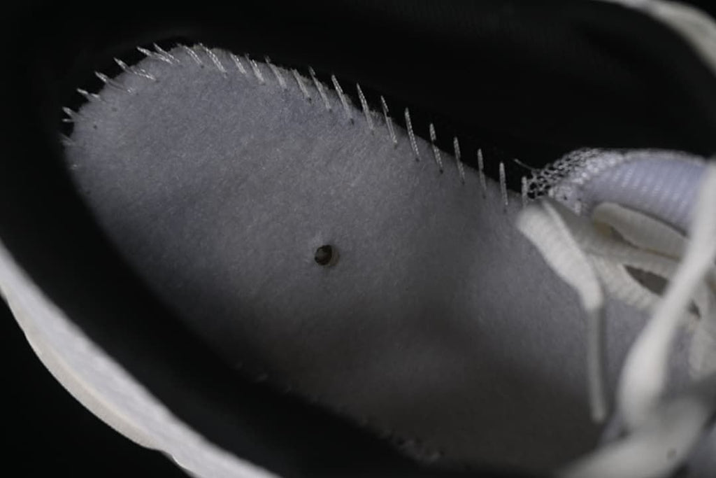 Interior view showing the lining and stitching of the Nike sneaker.
