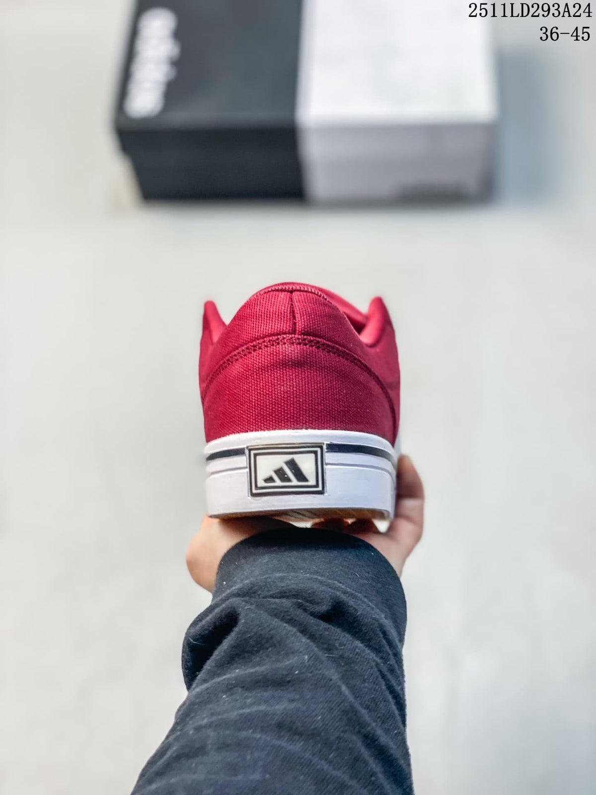Rear view showing the burgundy heel and white sole of the sneaker