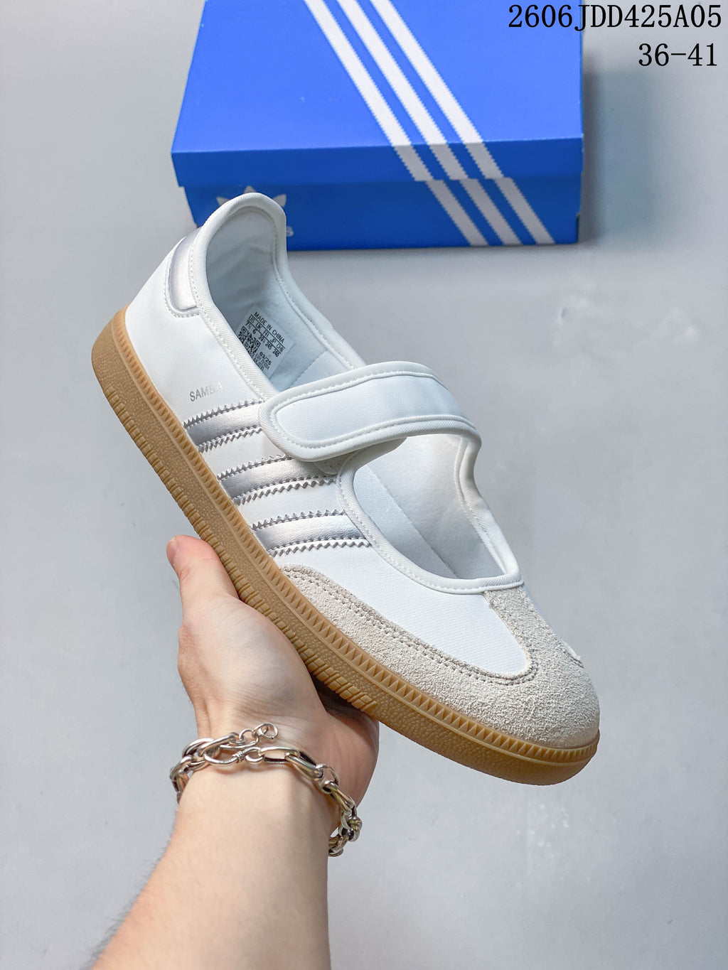 Angled view of the sneaker showing the side stripes and toe overlay