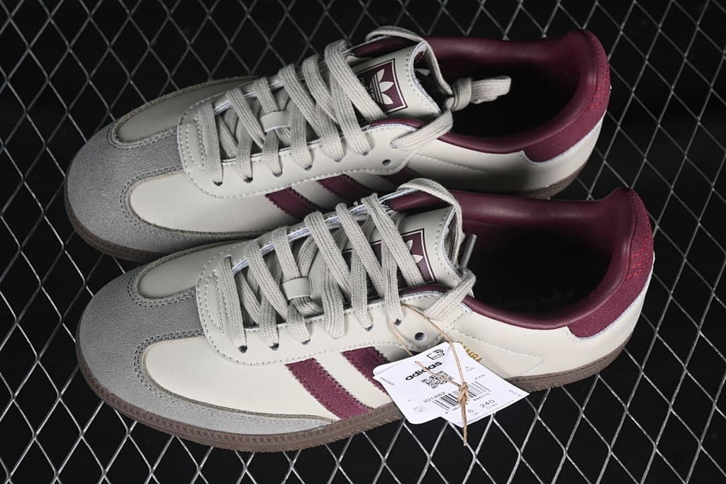 Pair of cream and burgundy Samba OG sneakers photographed from above.