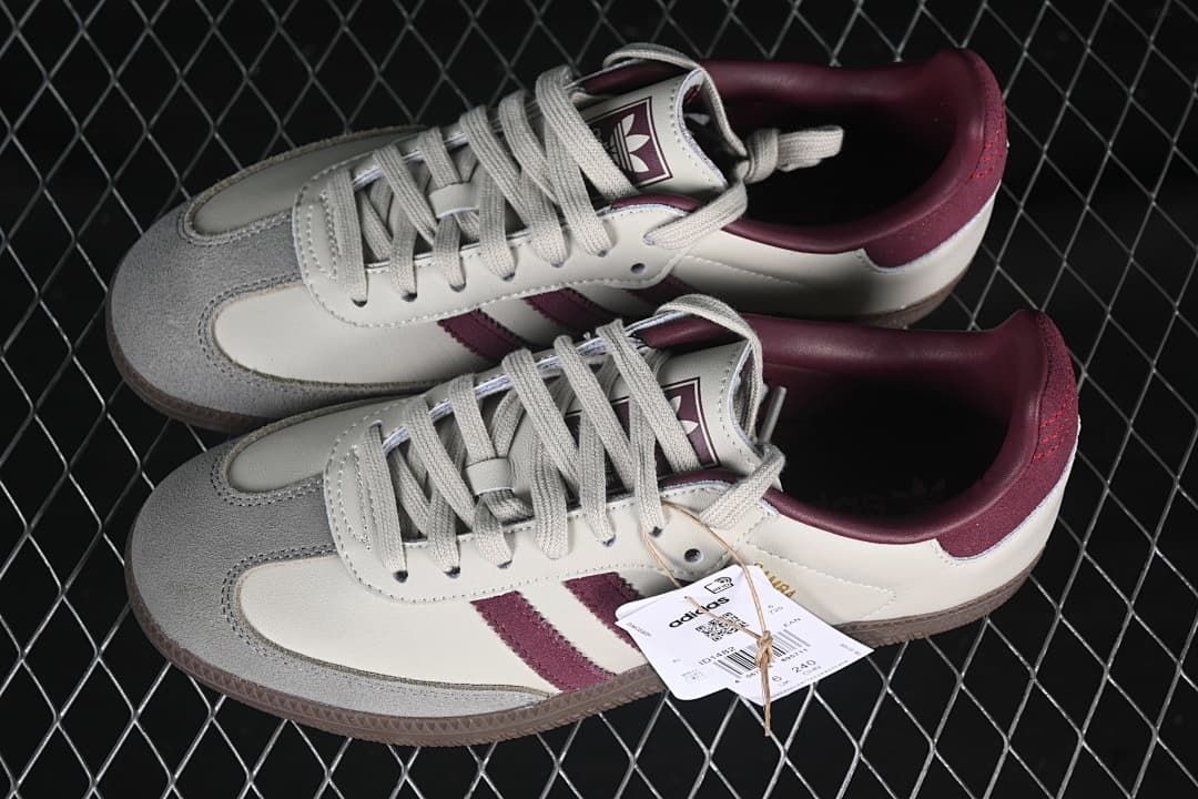 Pair of cream and burgundy Samba OG sneakers photographed from above.