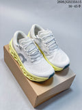 Pair of white On Cloudmonster 3 running shoes with gray details and pale yellow soles