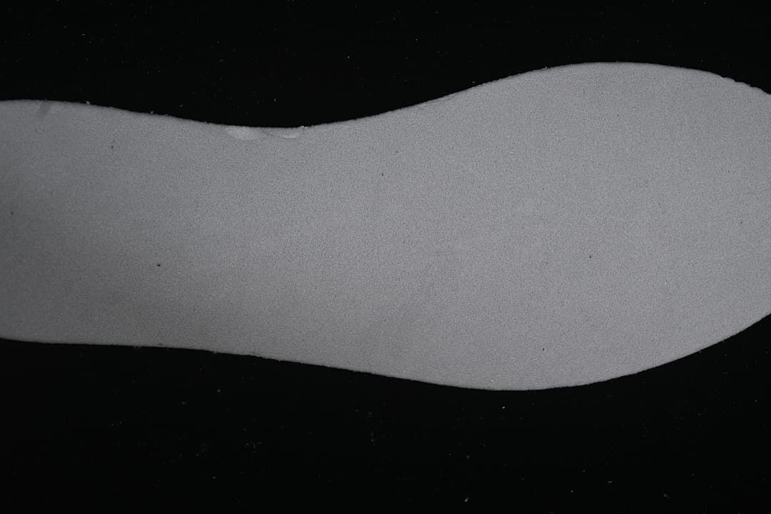 Close-up view of a gray shoe sole component