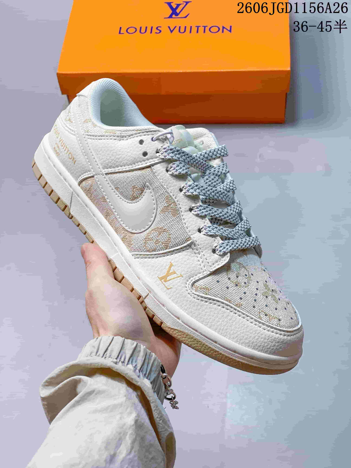 Close-up of a cream low-top sneaker with tan patterned overlays and pale laces