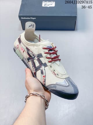 Onitsuka Tiger Mexico 66 sneaker in an off-white colorway with dark patterned side stripes and red laces.