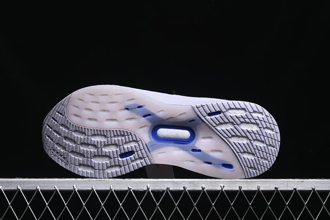 Underside showing the patterned outsole and blue-toned details