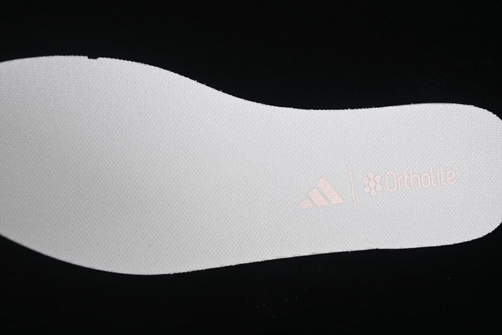 White shoe insert with adidas and OrthoLite branding