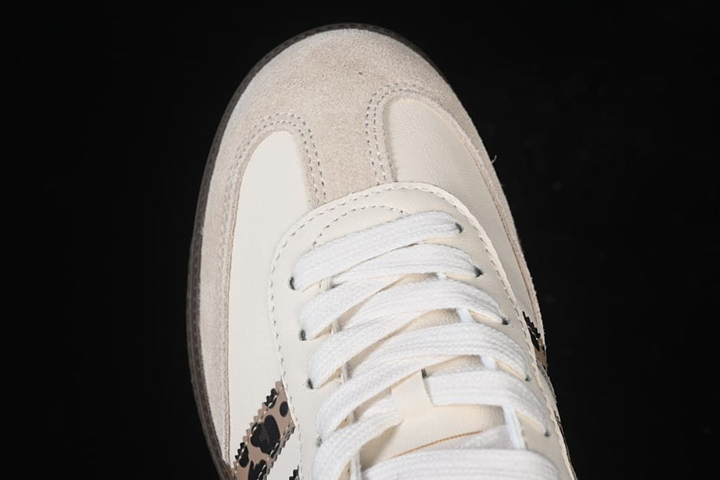 Top-down detail of the white laces and suede-look toe overlay