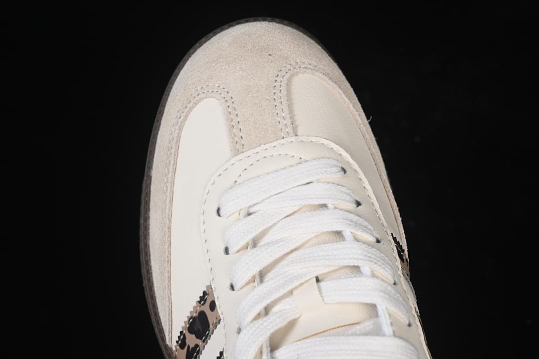 Top-down detail of the white laces and suede-look toe overlay