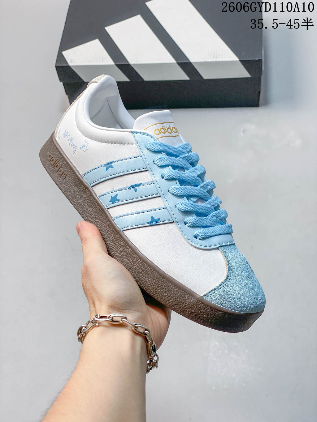 Angled side view showing star accents on the light-blue stripes