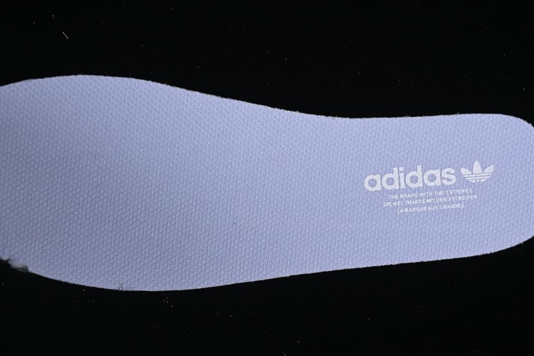 Close-up of a lavender insole with Adidas Originals branding