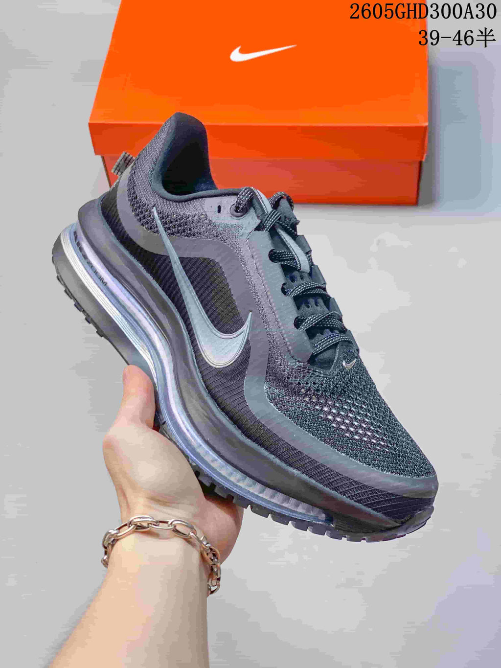 Angled side view of the charcoal Nike running shoe with a prominent Swoosh and cushioned sole.