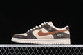 Side view of low-top Dunk sneakers in brown, beige, and off-white with a brown Swoosh.