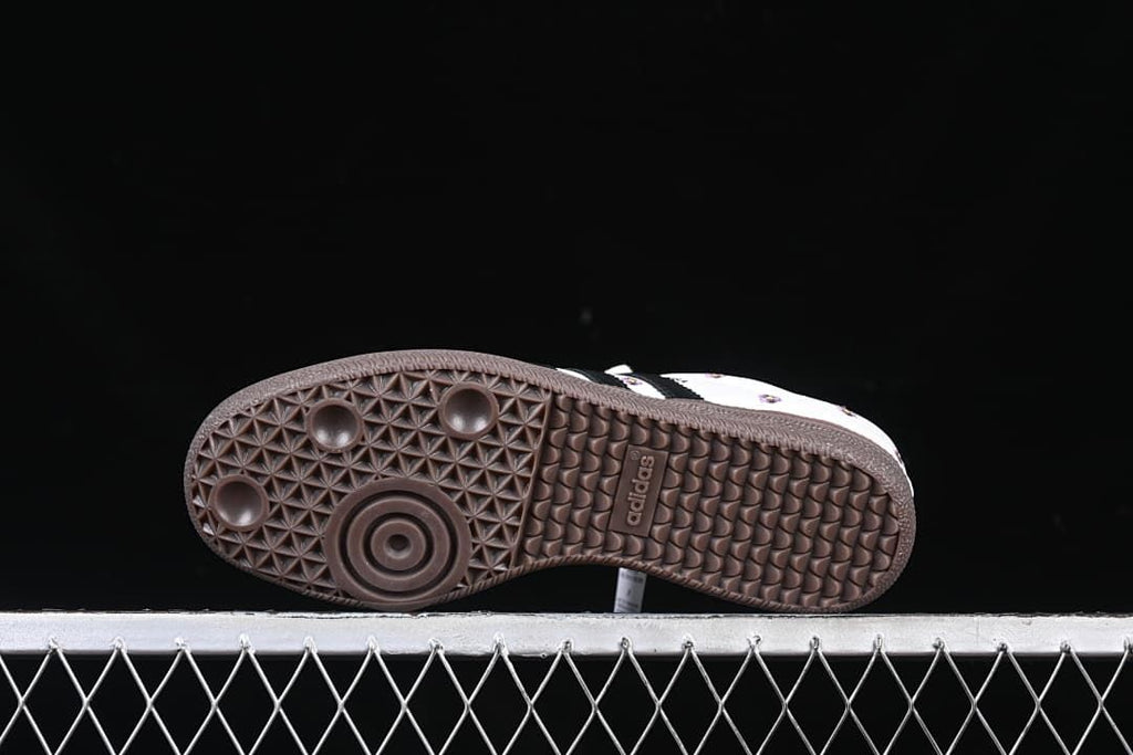 Underside view of the dark brown patterned outsole